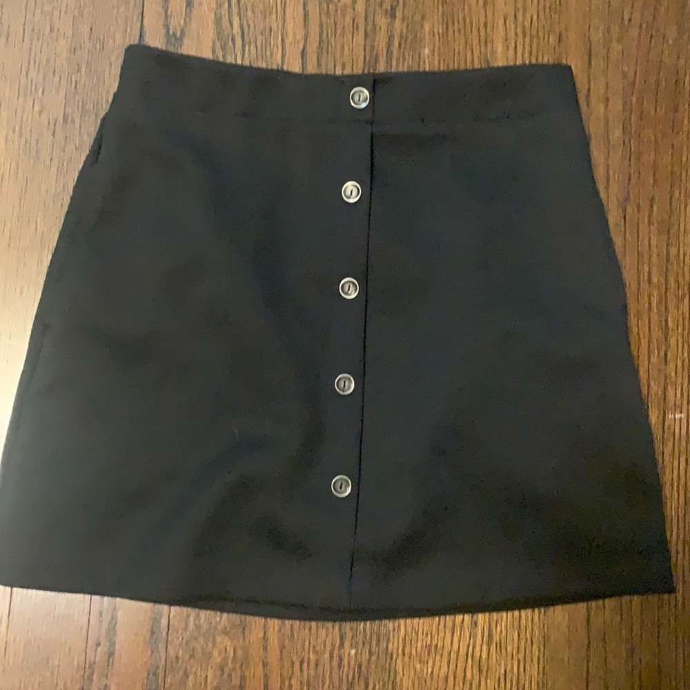 Black woven mini skirt with button up detail
